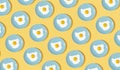 Miniature blue plates with fried eggs on a yellow background