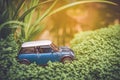 Miniature blue tin car closeup outdoor