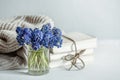 A miniature bouquet of muscari flowers in a transparent vase copy space Royalty Free Stock Photo