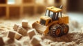 toy bulldozer pushing sugar cubes in sand Royalty Free Stock Photo