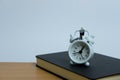 Miniature business concept - a man standing above clock and notebook. workload concept Royalty Free Stock Photo