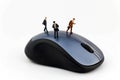 Miniature business men on a computer mouse Royalty Free Stock Photo