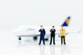 Miniature business people : businesses team with plane. Image use for background travel, business trip travel advisory agency Royalty Free Stock Photo