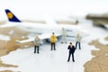 Miniature business people : businesses team with plane. Image use for background travel, business trip travel advisory agency Royalty Free Stock Photo