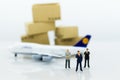 Miniature business people : businesses team with plane. Image use for background travel, business trip travel advisory agency Royalty Free Stock Photo