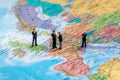 Miniature business people on map of Europe Royalty Free Stock Photo