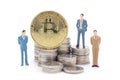 Miniature businessman and Bitcoin on white background