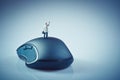 Miniature businessman waving on top of computer mouse. Business Royalty Free Stock Photo