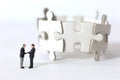 Miniature businessmen shaking hands Royalty Free Stock Photo