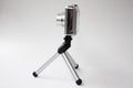 Miniature camera and tripod Royalty Free Stock Photo