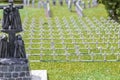 Miniature cemetery park with many white crosses of green grass. Royalty Free Stock Photo