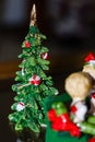 Miniature ceramic Christmas tree sitting on a table