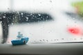 Miniature ceramic ship with rain water drops background