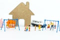 Miniature children: Group childrens are playing together on playground. Image use for Children`s Day. Royalty Free Stock Photo