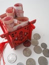 Miniature Chinese pavilion in bright red and filled with Chinese bills