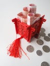 Miniature Chinese pavilion in bright red and filled with Chinese bills