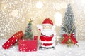 Miniature Christmas Santa cros and Tree on snow over blurred bokeh background,Decoration Image for Christmas Holiday and Happy New Royalty Free Stock Photo