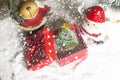 Miniature Christmas Santa cros and Tree on snow over blurred bokeh background,Decoration Image for Christmas Holiday and Happy New Royalty Free Stock Photo