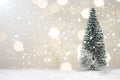 Miniature Christmas Santa cros and Tree on snow over blurred bokeh background,Decoration Image for Christmas Holiday and Happy New Royalty Free Stock Photo