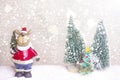 Miniature Christmas Santa cros and Tree on snow over blurred bokeh background,Decoration Image for Christmas Holiday and Happy New Royalty Free Stock Photo