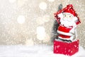 Miniature Christmas Santa cros and Tree on snow over blurred bokeh background,Decoration Image for Christmas Holiday and Happy New Royalty Free Stock Photo