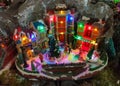 Miniature christmas village with colored lights at santa claus village shop in Terni Royalty Free Stock Photo