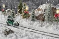 Miniature classic car carrying a christmas tree on snowy road on winter Royalty Free Stock Photo