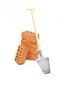 Miniature clinker bricks with spade Royalty Free Stock Photo