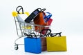 miniature colorful paper bags, shopping trolley on white background Royalty Free Stock Photo