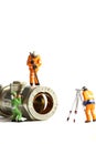 Miniature construction workers plumbing valve Royalty Free Stock Photo