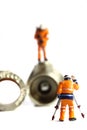 Miniature construction workers plumbing valve Royalty Free Stock Photo