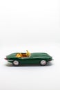 Miniature convertible green car isolated on a white background Royalty Free Stock Photo