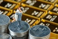 Miniature couple figure standing on stack of coins with shiny go Royalty Free Stock Photo