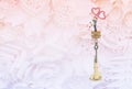 Miniature couple on message in the bottle on flower pattern background