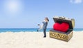 Miniature couple with red heart in treasure box on tropical beach, love and romance concept Royalty Free Stock Photo