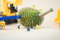 Miniature crime scene investigator with little of fresh young durian Royalty Free Stock Photo