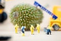 Miniature crime scene investigator with little of fresh young durian