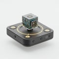 Miniature Cube Camera with Intricate Circuits on a Black Base in a White Background Royalty Free Stock Photo