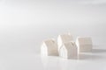 Miniature 3D printed model house on white background