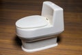 Miniature decorative white toilet