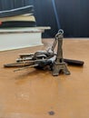 Miniature Eiffel tower key chain and some keys and books Royalty Free Stock Photo