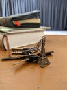 Miniature Eiffel tower key chain and some keys and books Royalty Free Stock Photo