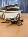 Miniature Eiffel tower key chain and some keys and books Royalty Free Stock Photo