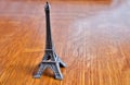 Miniature Eiffel Tower on a wood background