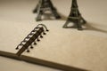 Miniature Eiffel towers and a sketch book
