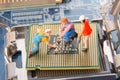 Miniature engineers or technician workers repairing CPU on the motherboard. Computer service and technology concept. Royalty Free Stock Photo