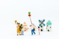 Miniature family: Childrens playing balloon together. Image use for background International day of families concept Royalty Free Stock Photo