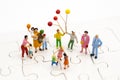 Miniature family: Childrens playing balloon together. Image use for background International day of families concept