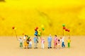 Miniature family: Childrens playing balloon together. Image use for background International day of families concept