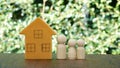 Miniature family house and wooden dolls